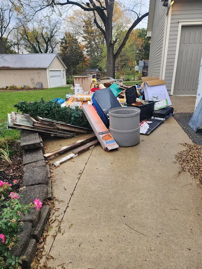 Dumpster being loaded with debris for Residential Dumpster Rental in Marengo